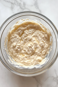 mixing-cream-cheese-sour-cream-mayo-in-clear-glass-bowl-over-marble-8673760-683x1024-6809063 step 2