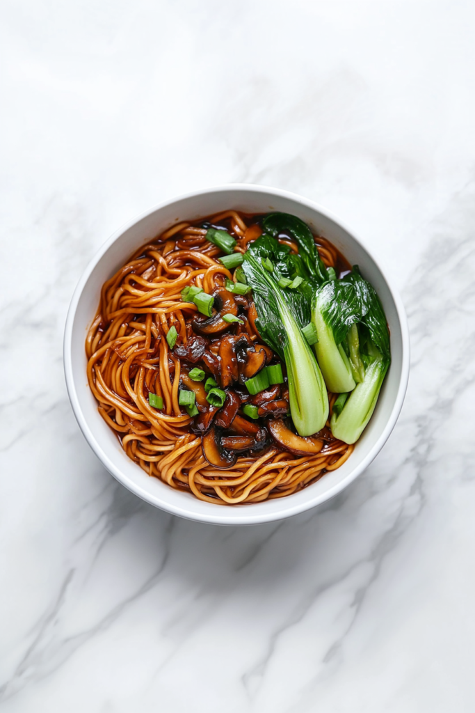 pouring-teriyaki-sauce-to-coat-noodles-and-veggies-evenly-2