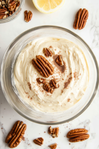 pressing-sweet-cheese-mixture-into-a-plastic-lined-bowl-for-shaping