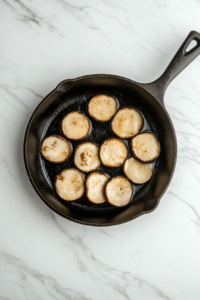 searing-mushroom-scallops-until-golden-in-skillet