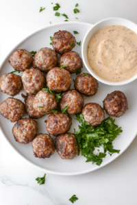 serving-freshly-baked-sausage-balls-warm-with-a-dipping-sauce-for-the-perfect-appetizer-top-down-shot-2