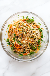 tossing-noodles-with-veggies-and-vinegar-dressing