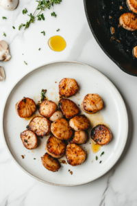 transferring-seared-mushroom-scallops-to-plate