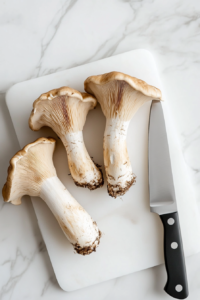 trimming-mushroom-ends-on-cutting-board