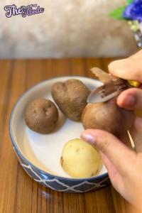 Peel and quarter the potatoes