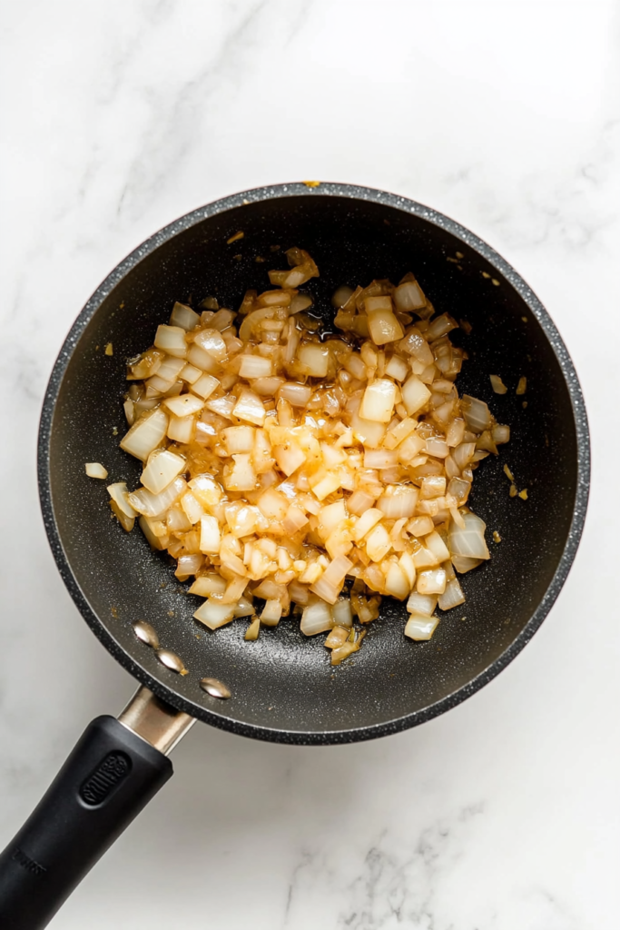 sauteing-onion-and-garlic-in-a-pan-for-rice-pilaf-3559173-683x1024