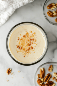 cream-cheese-filling-in-glass-bowl-with-pecans-top-down