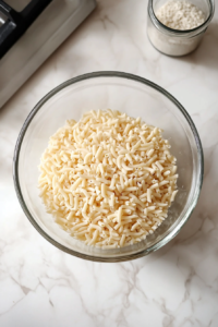 drained-elbow-macaroni-in-clear-glass-bowl