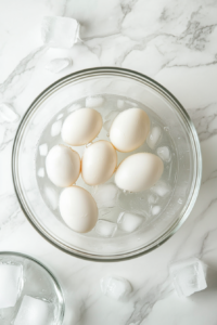 eggs-in-glass-bowl-ice-bath-white-marble