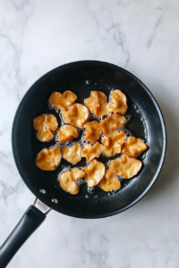 frying-oyster-mushrooms-until-golden-in-black-skillet