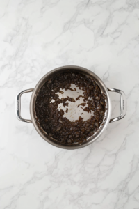 garlic-added-to-caramelized-onions-in-aluminum-pot