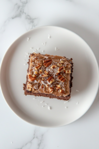 german-sweet-chocolate-cake-square-slice-on-white-ceramic-plate-final-presentation