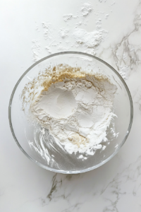 mixing-wet-and-dry-ingredients-in-glass-bowl-funfetti-bread