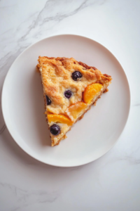 peach-blueberry-cake-finished-baked-on-white-marble-top