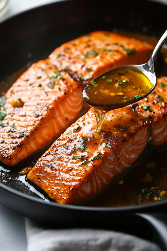 placing-seared-salmon-back-in-pan-to-absorb-hibachi-sauce-9484192-683x1024