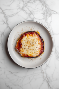 plated-eggplant-parmesan-on-white-ceramic-plate