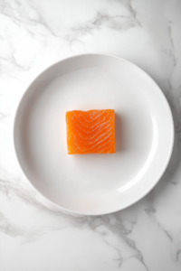 resting-smoked-salmon-on-white-ceramic-plate-marble-surface
