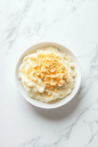 serving-warm-crockpot-creamy-cheesy-potatoes-from-black-crockpot