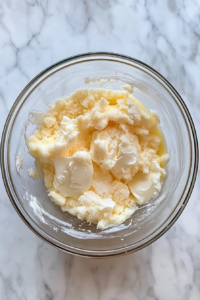 wet-ingredients-in-glass-bowl-for-funfetti-quick-bread