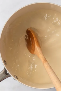 Boil sugar and ½ cup water until dissolved