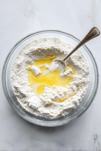 buttermilk-clumped-flour-mixture-in-clear-bowl