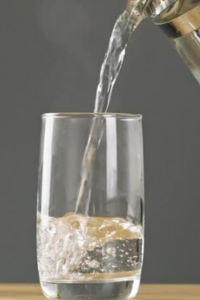 Pour warm filtered water into a glass