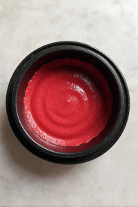 pouring-in-the-batter-of-red-velvet-pound-cake-into-the-bundt-pan