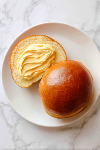 spreading-spicy-mayo-on-brioche-bun-halves-2