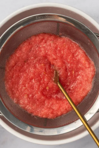 Strain through a fine mesh sieve