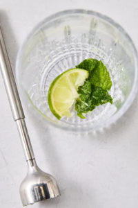 Use a cocktail muddler to gently crush