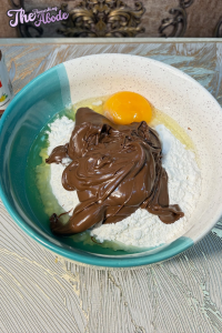 add Nutella, flour, and 1 egg