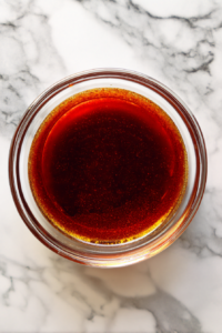 basting-sauce-mixture-of-apple-juice-brown-sugar-bbq-in-glass-bowl