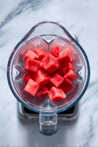 blending-watermelon-cubes-in-glass-blender-on-marble