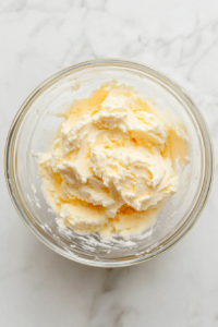 butter-and-sugar-creamed-in-clear-glass-mixing-bowl