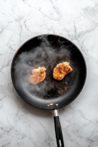 chicken_breasts_seared_in_large_black_skillet_with_cajun_spices-2