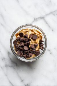 chocolate-chips-and-peanut-butter-in-glass-bowl-ready-to-microwave