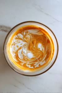combining-pumpkin-buttermilk-vanilla-in-glass-bowl