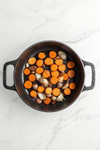 dding-carrots-to-sauteed-onion-garlic-in-dutch-oven