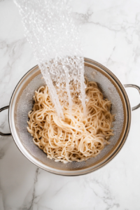 draining-boiled-soba-noodles-using-colander-2