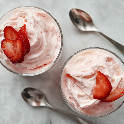 elegant-strawberry-fool-dessert-glasses-on-white-marble
