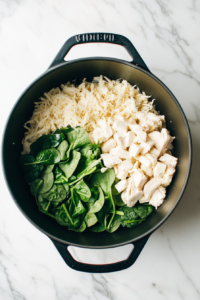 final-simmer-of-marry-me-chicken-soup-in-black-dutch-oven