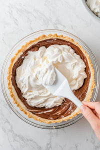folding-in-whipped-topping-and-transferring-filling-into-crust