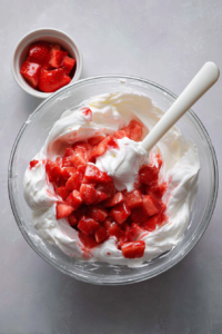 folding-strawberries-into-whipped-cream