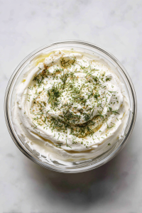 garlic-dill-sauce-in-glass-bowl-marble-countertop