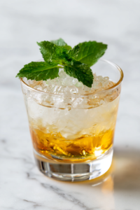 garnished-mint-juleps-ready-to-serve-on-white-marble