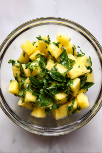 glass-bowl-mixing-pineapple-basil-lime-white-marble