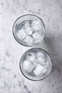 ice-filled-clear-glasses-on-white-marble