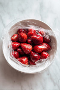 juicy-strawberries-marinated-in-white-ceramic-bowl