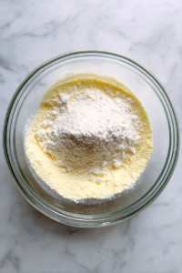 mixing-almond-powdered-allpurpose-eggs-glass-bowl
