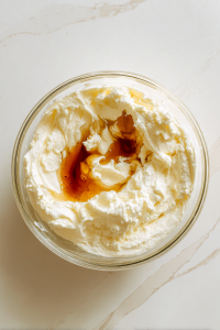 mixing-in-the-vanilla-extract-in-batter-for-red-velvet-pound-cake